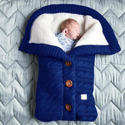 gigoteuse bébé en tricot bleu marine - nid d'ange