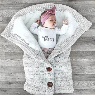 gigoteuse bébé en tricot gris clair - nid d'ange