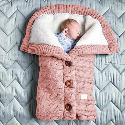 gigoteuse bébé en tricot couleur pêche - nid d'ange