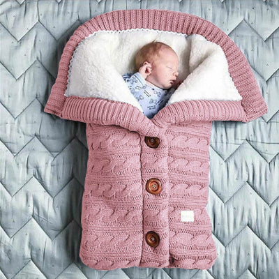 gigoteuse bébé en tricot couleur poudre - nid d'ange