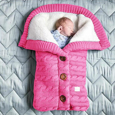 gigoteuse bébé en tricot rose - nid d'ange