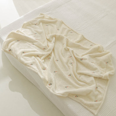 couverture bébé beige en velours avec tulipes