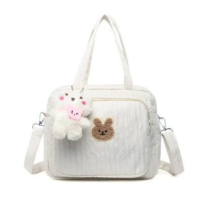 sac a langer blanc avec pendentif ourson